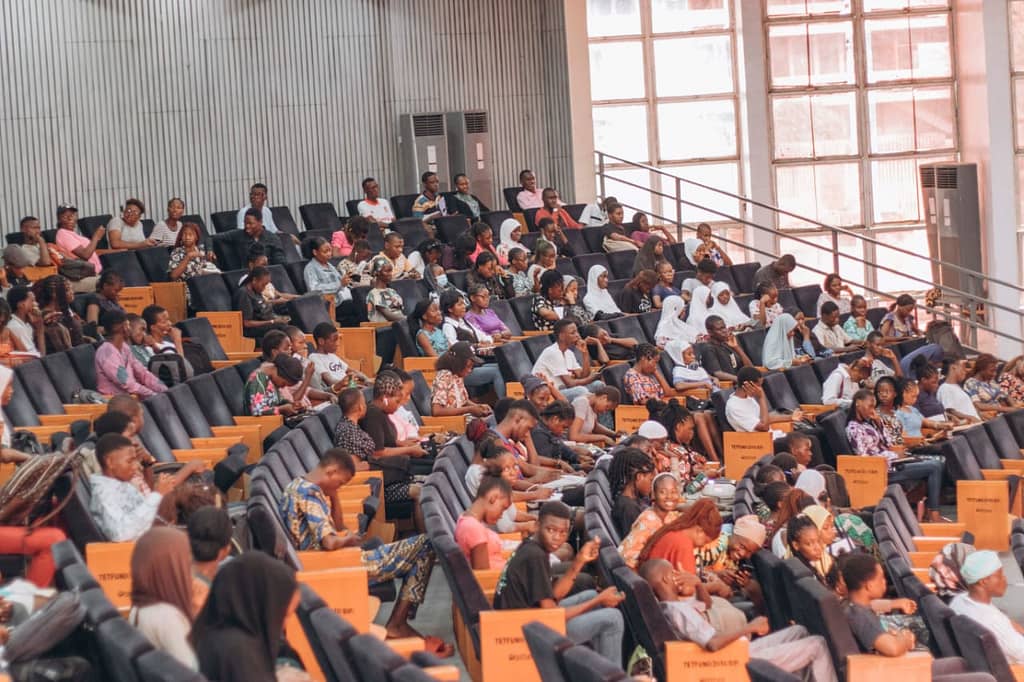 Youths seated in a meeting